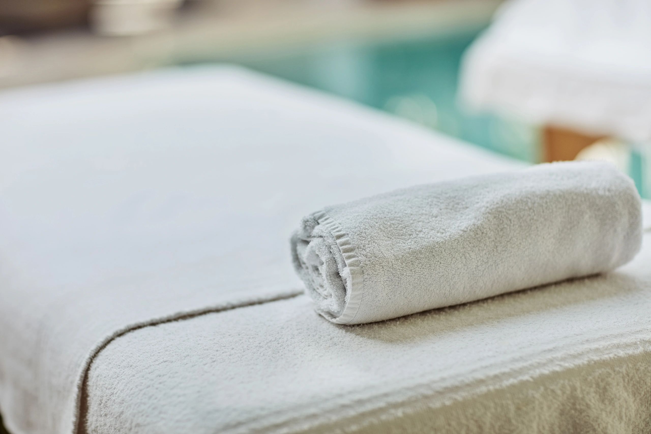 Clean, serene spa room prepared with fresh linens